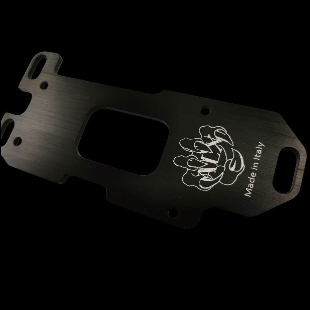 Black metal engine mount plate with white logo and 'Made in Italy' text on a black background