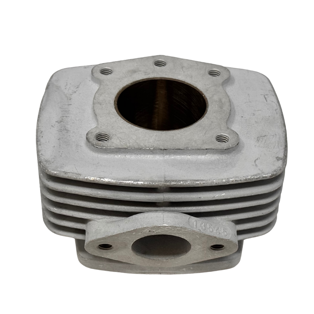 Metal engine cylinder head on a white background