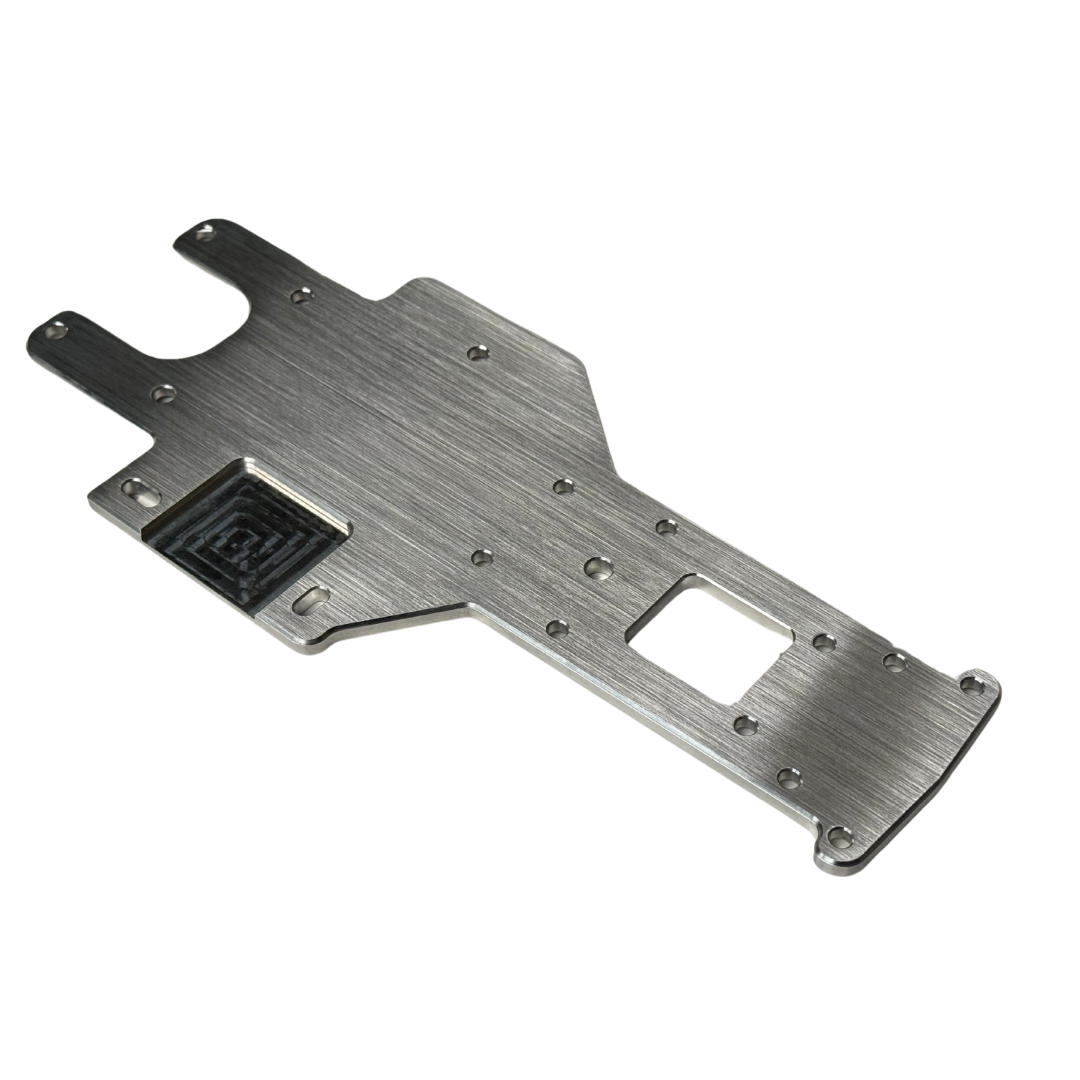 Metallic chassis plate with cutouts on a white background