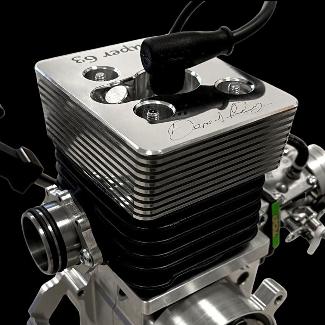 Close-up of a metallic engine block with visible branding on a black background