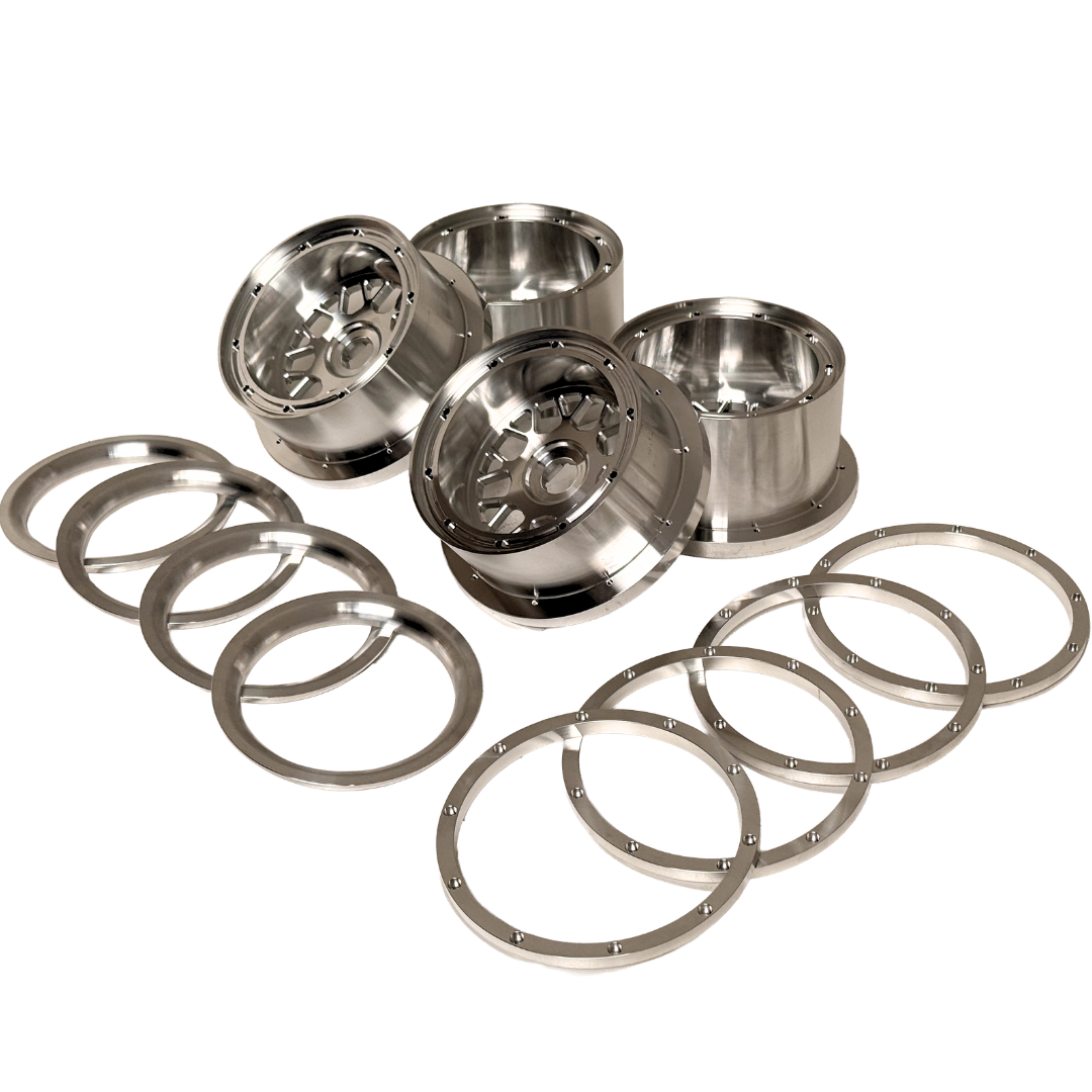 Beast RC Baja 5B complete billet wheel set with 8-piece beadlocks, angled view from an alternate angle showing the wide 5B rear wheels with hidden-bolt beadlock rings