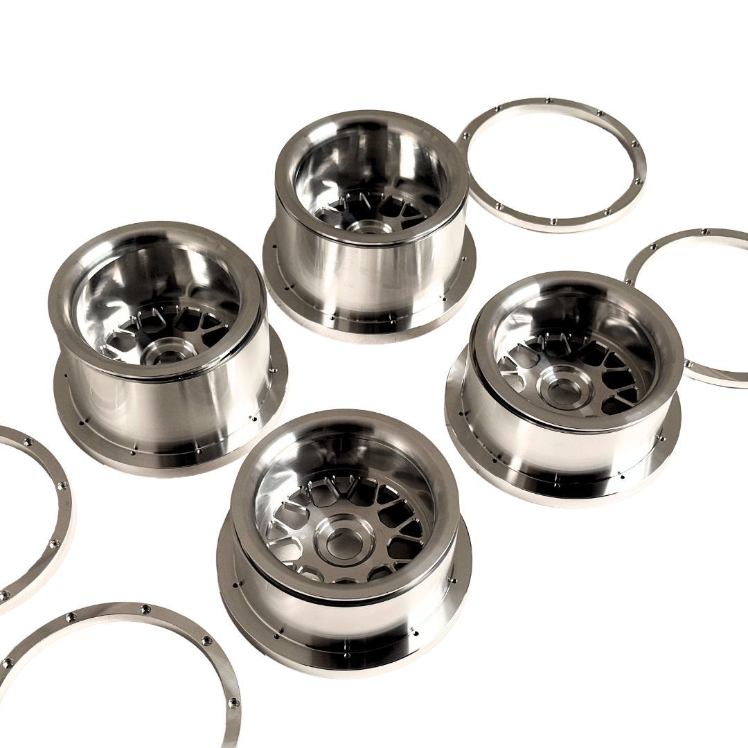 Beast RC Baja 5B complete billet wheel set with 8-piece beadlocks, top-down view showing the wide 5B rear wheels with hidden-bolt beadlock rings
