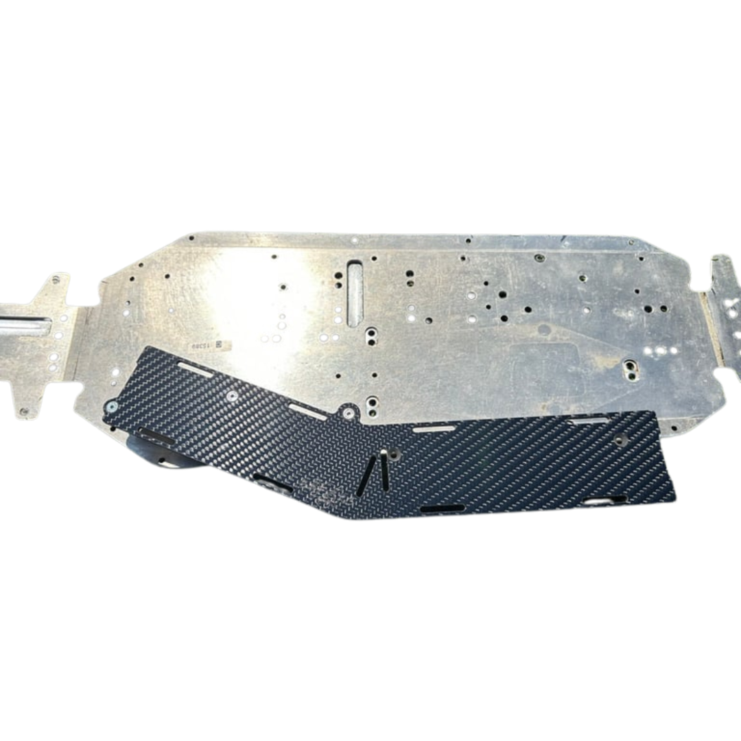 Metal and carbon fiber car underbody protection panel on a white background