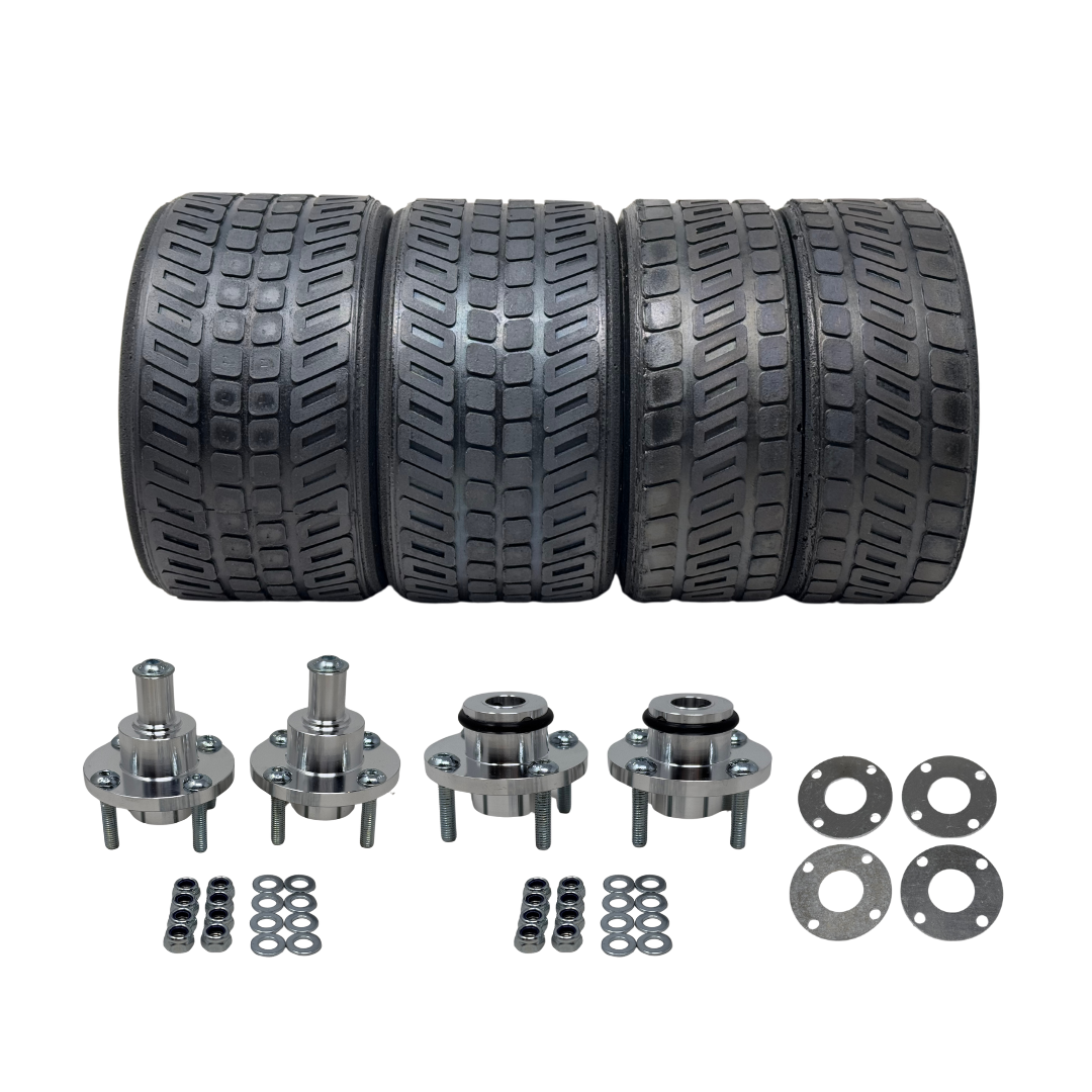 Set of four tires and their corresponding metal components on a white background
