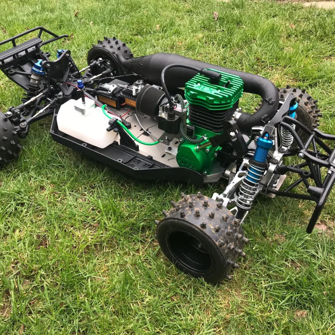 Model off-road vehicle with green engine on grass
