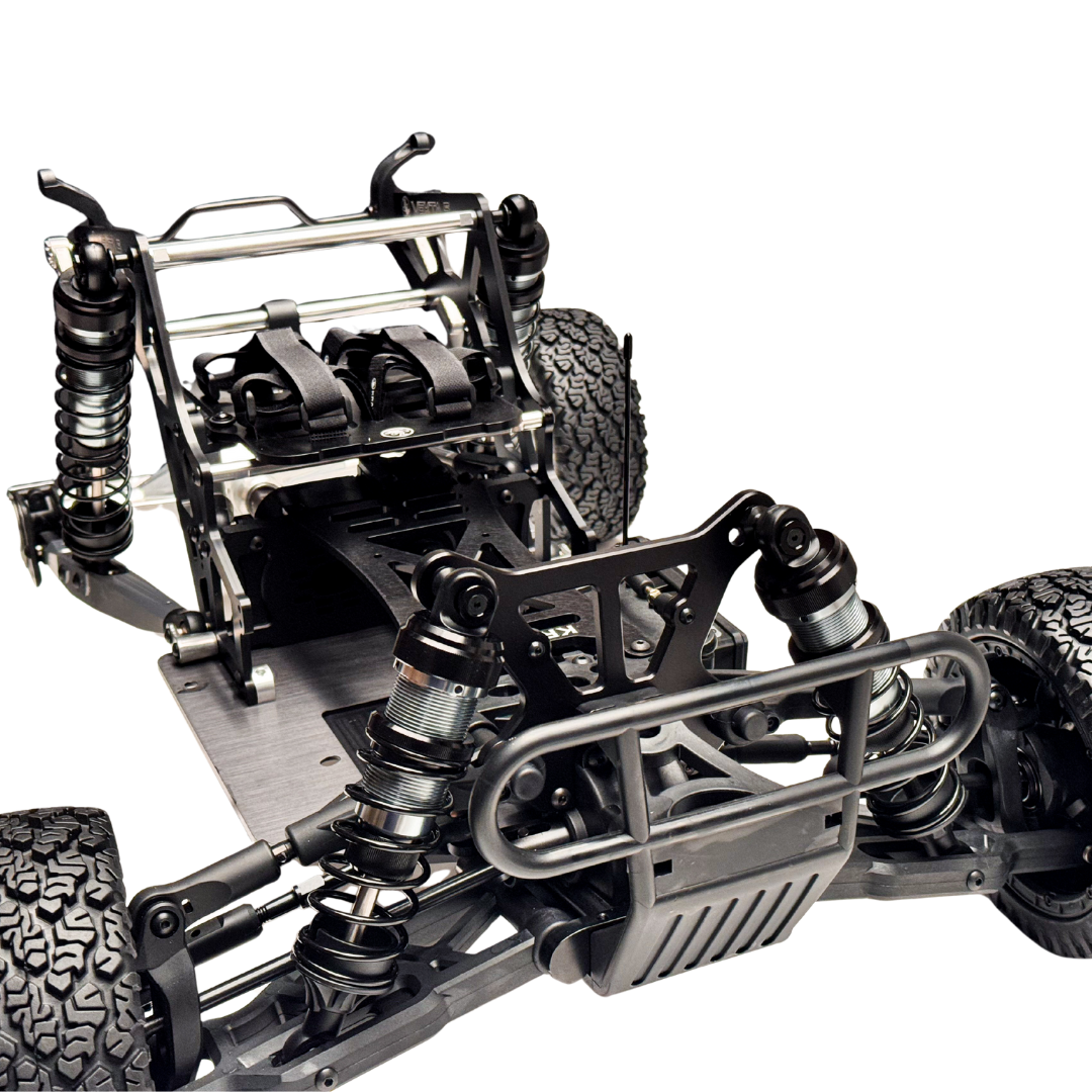 Close-up of a detailed metal chassis of a remote control car on a white background