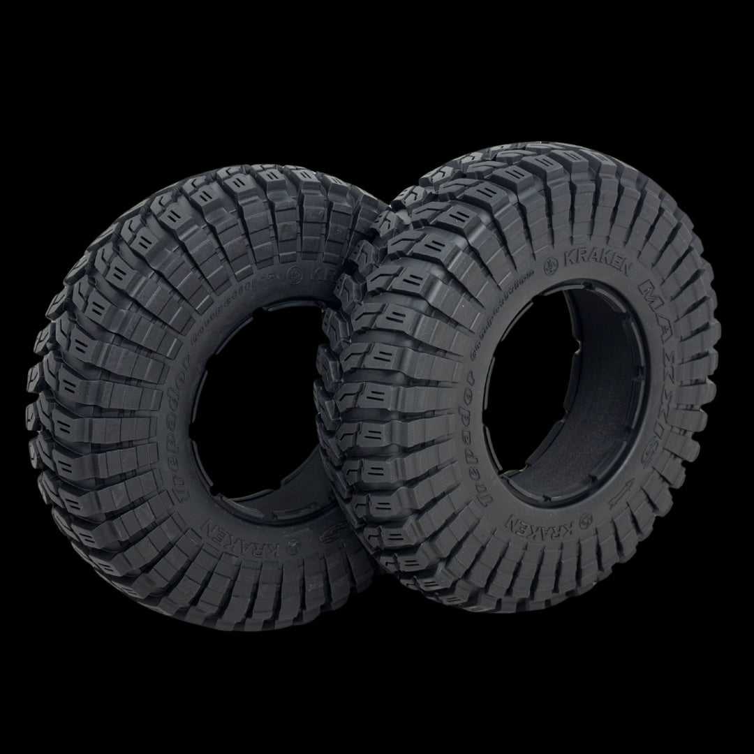 Two off-road tires with tread pattern on a transparent background