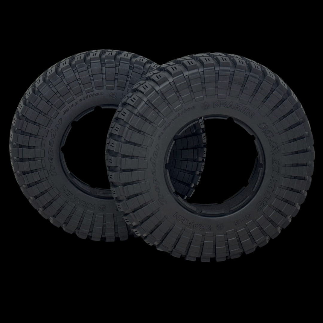 Two black tires with tread patterns on a transparent background