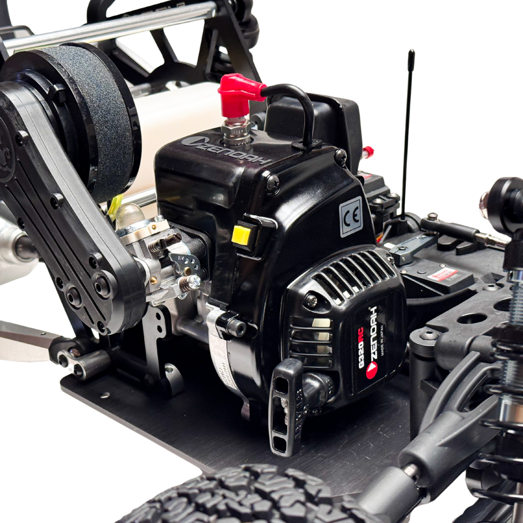 Close-up of a model engine and mechanical parts on a white background