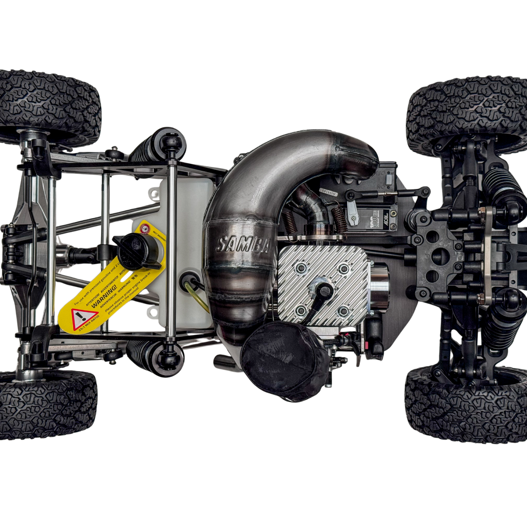 Close-up of a model car chassis with visible engine components on a white background