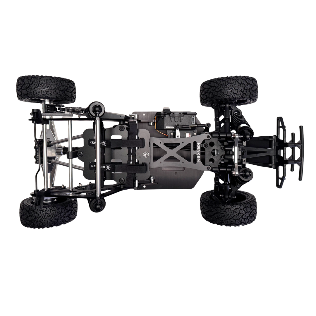 Black off-road vehicle chassis with large wheels on a white background