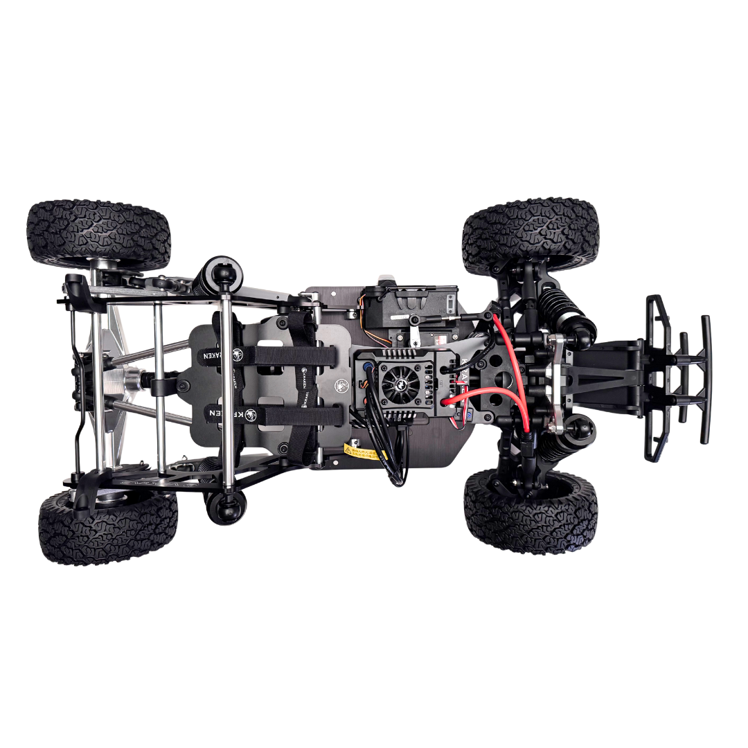 Black off-road vehicle chassis with suspension and tires on a white background
