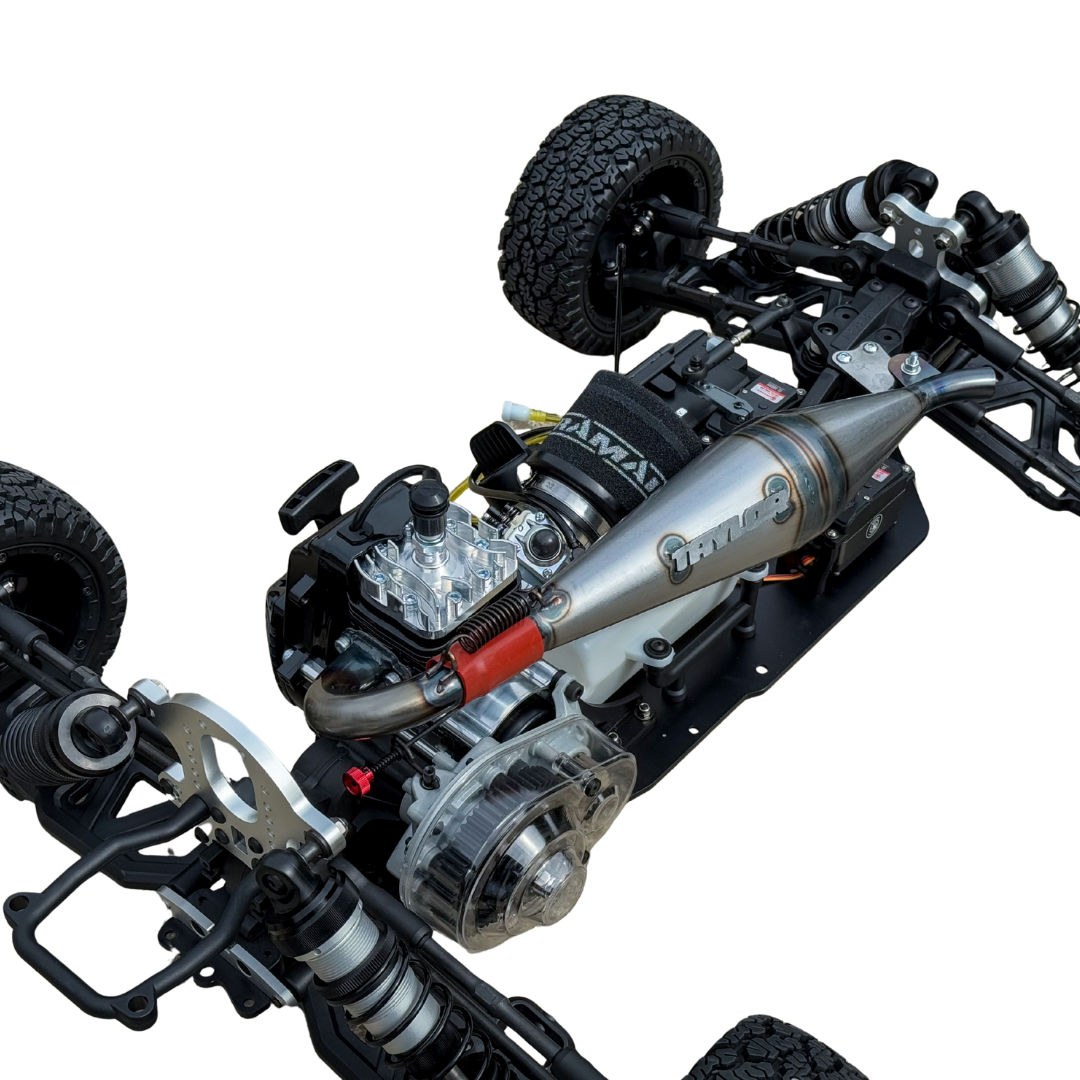 Close-up of a detailed model car chassis with visible branding on a white background