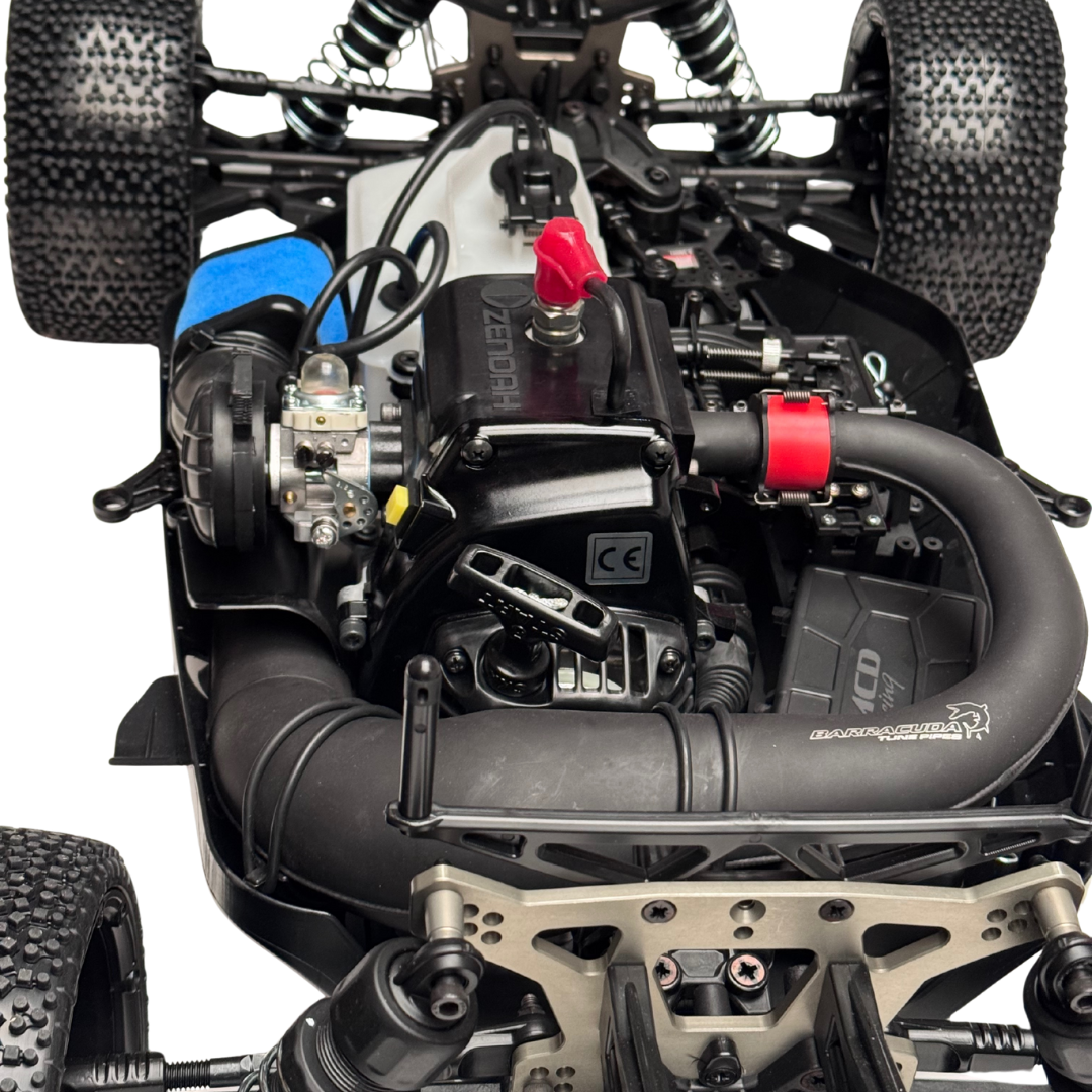 Close-up of a remote control car's engine and mechanical components on a white background