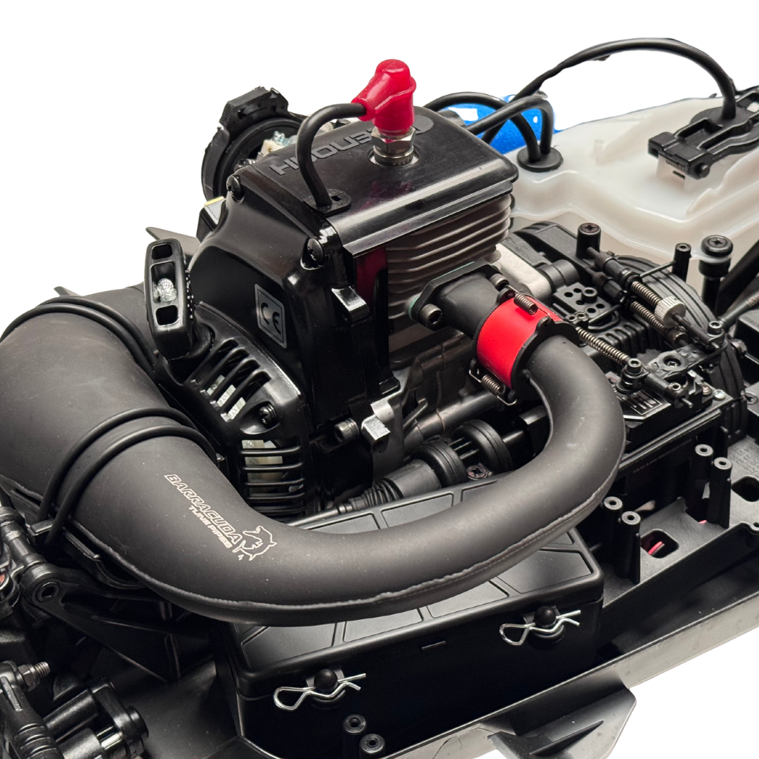 Close-up of a model engine with visible branding on a white background