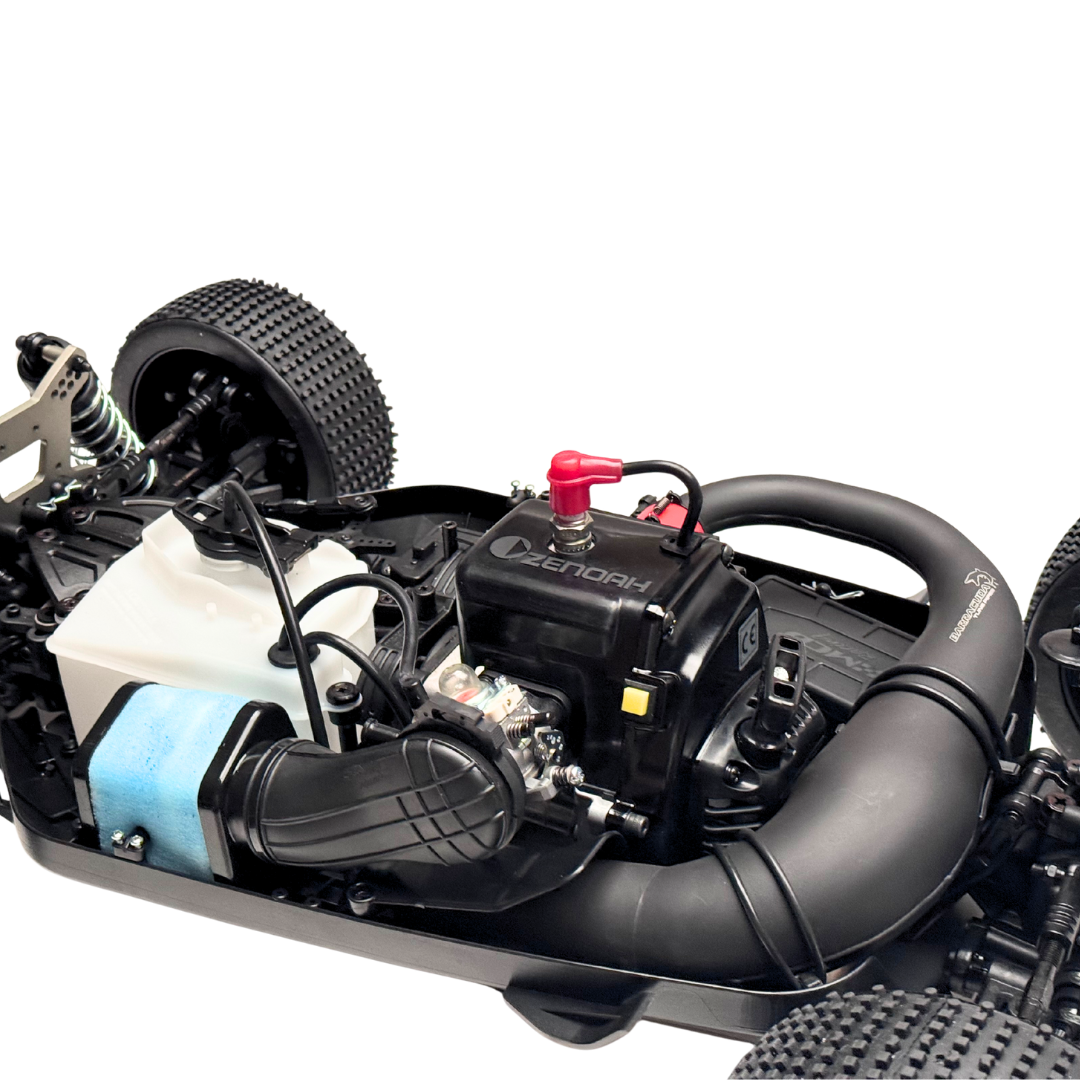 Close-up of a model car engine and chassis on a white background
