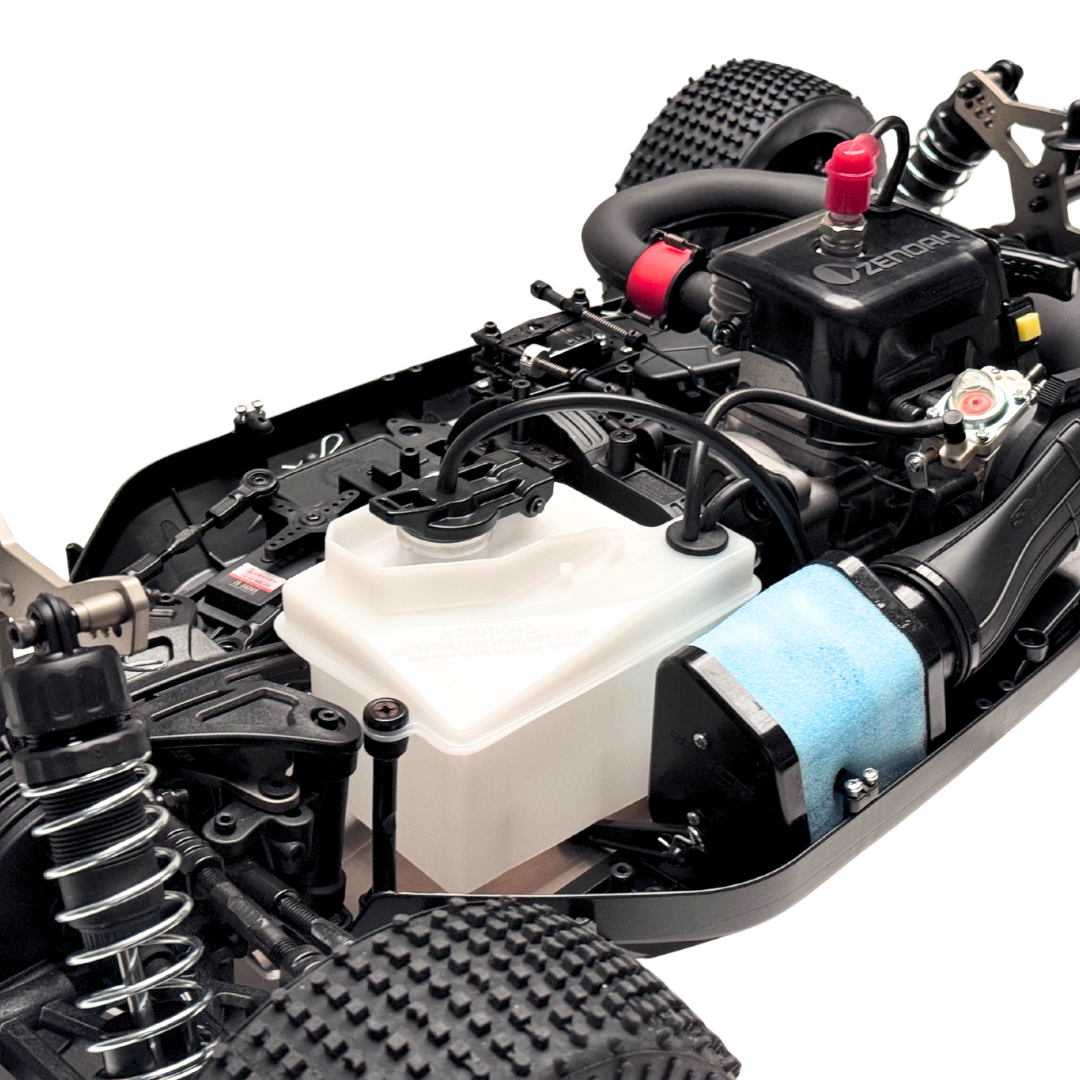 Close-up of a detailed model car chassis with various components on a white background