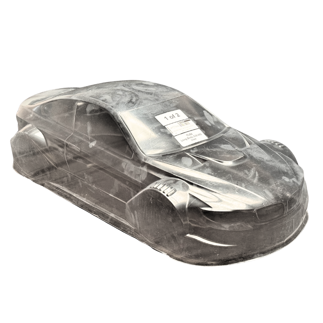 Clear plastic model car body on a white background