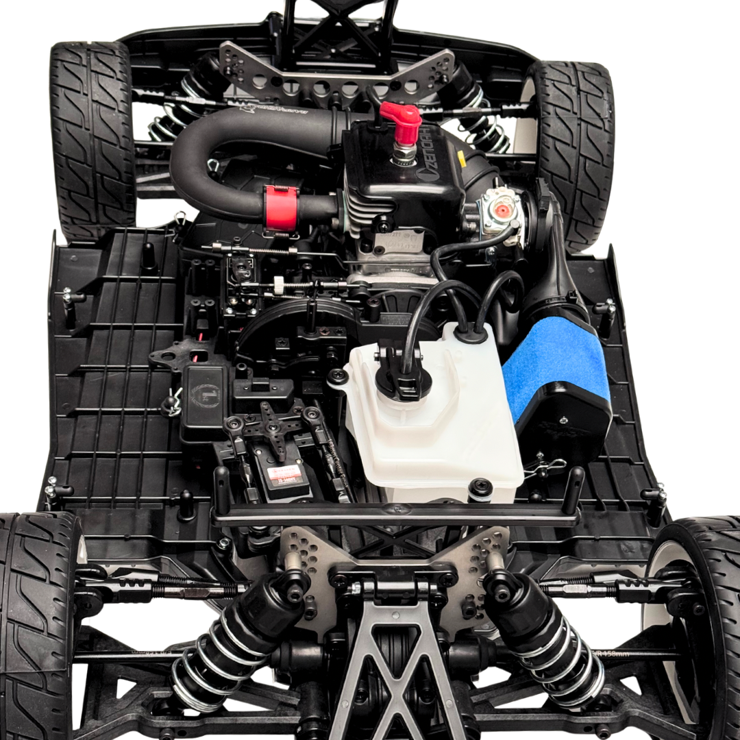 Close-up of a detailed model car chassis with various components.