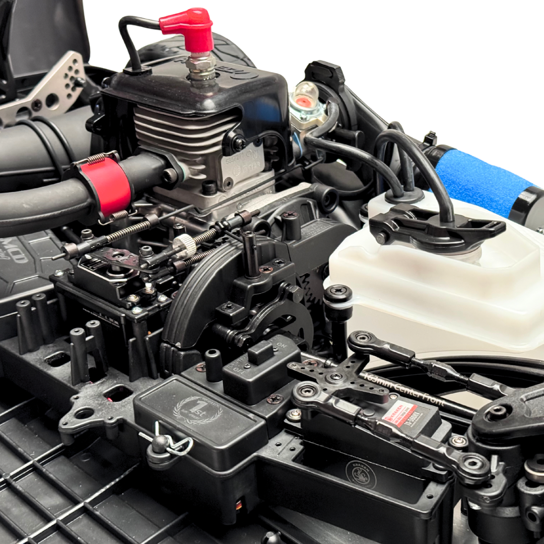 Close-up of a detailed model engine with various components and hoses.