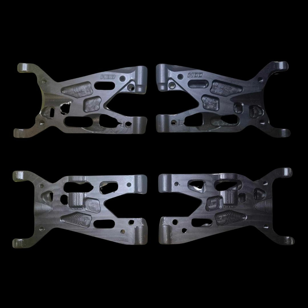 A set of four machined front arms for a Losi 5T and 2.0 remote control vehicle, featuring cut-out holes and mounting points, displayed on a dark background.