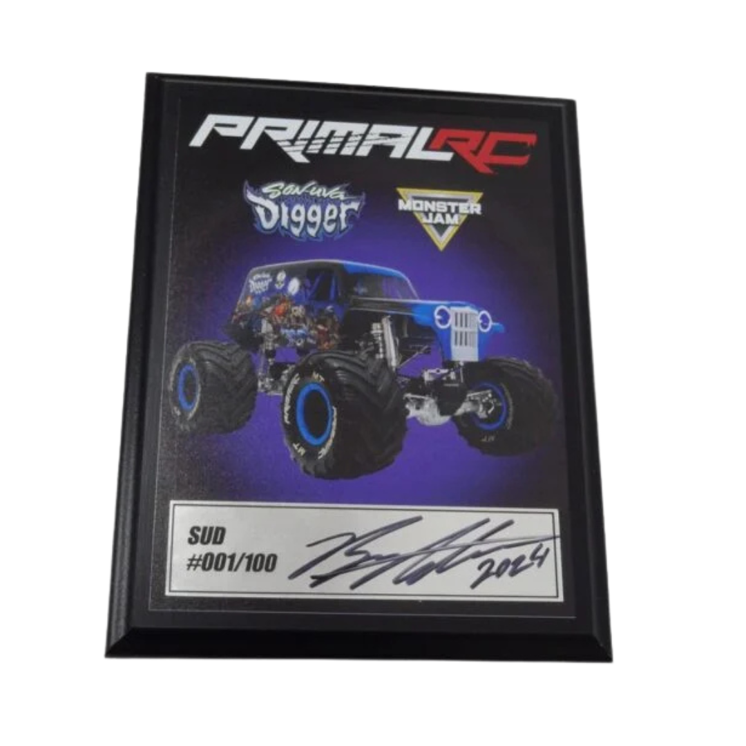 Framed collectible featuring a monster truck with 'Primal RC' branding on a white background