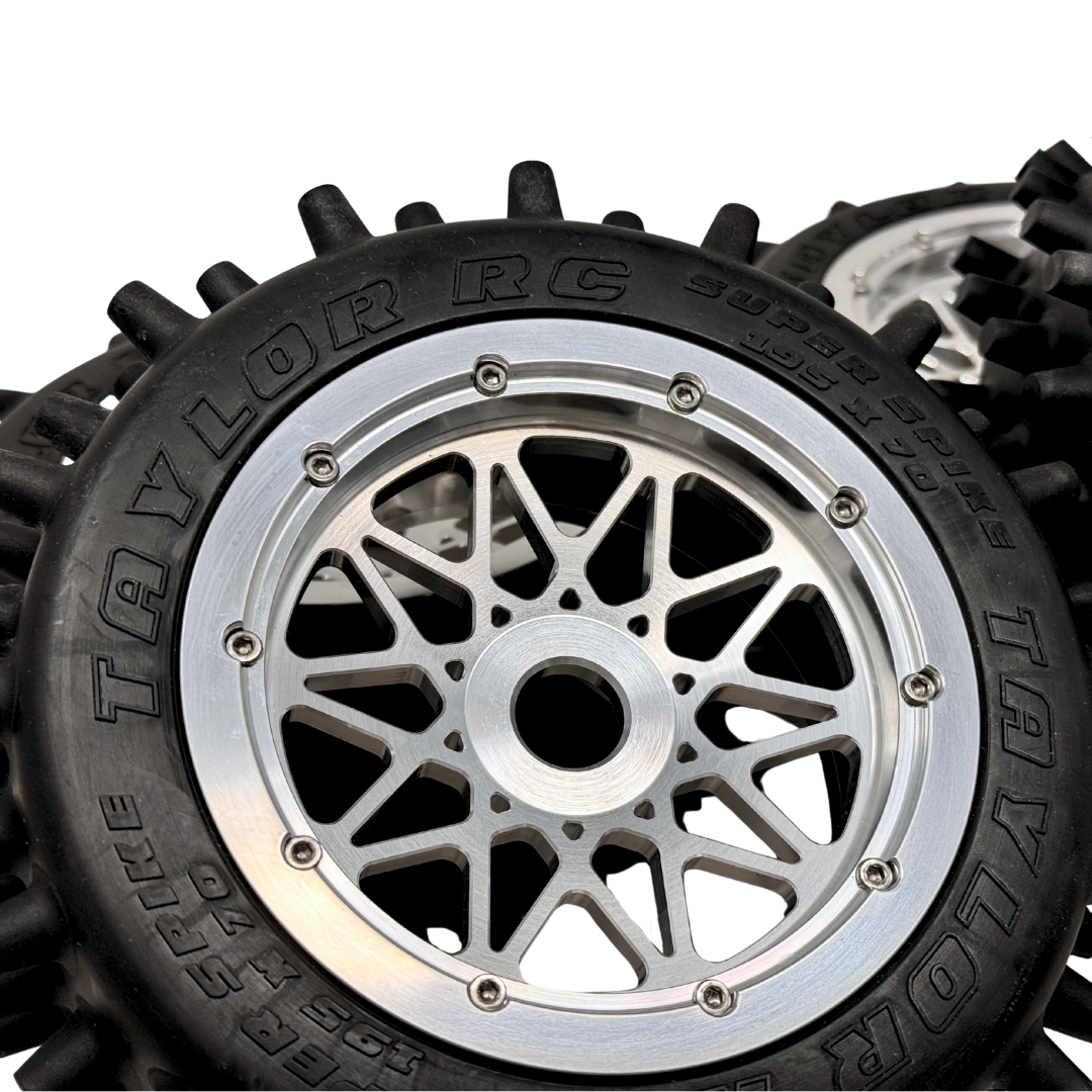 Close-up of a Taylor RC model car wheel with detailed tread pattern and rim design.