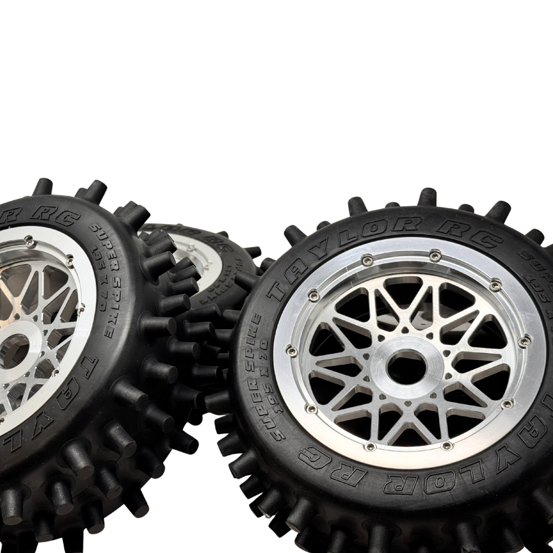 Black tires with silver rims on a white background