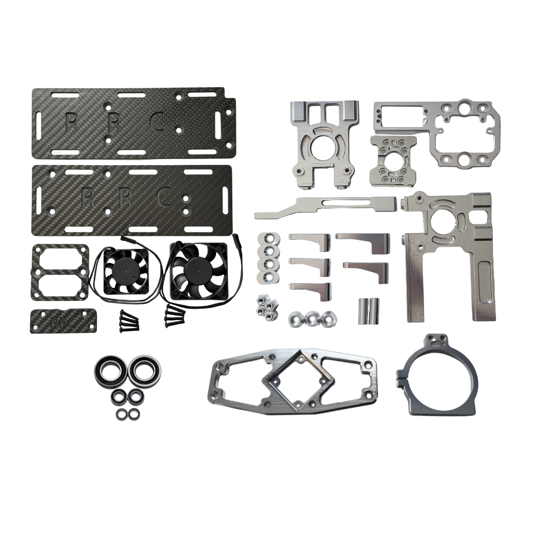Collection of mechanical parts including carbon fiber plates, metal brackets, and gaskets on a white background.