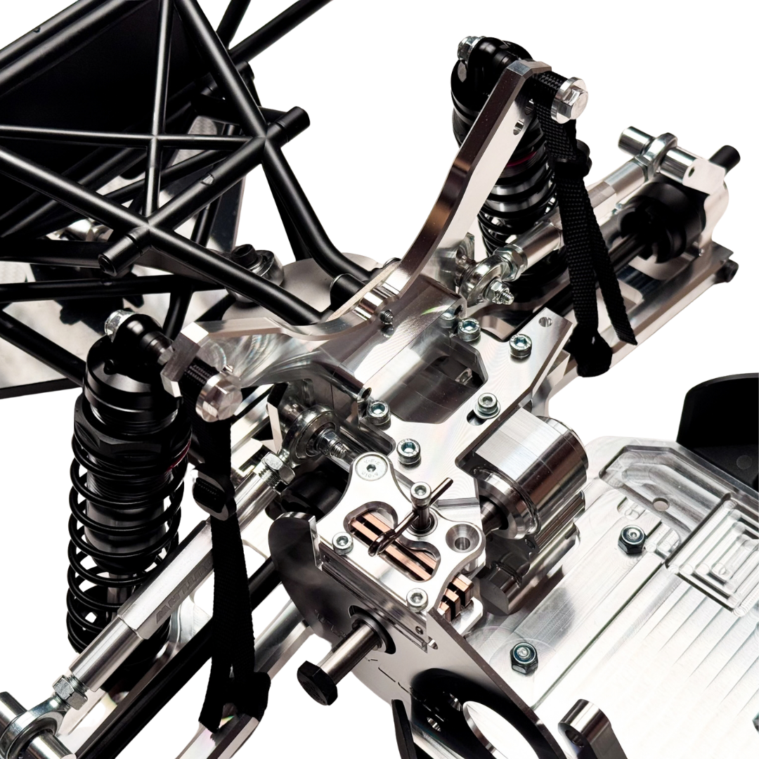Taylor RC Complete Outlaw V4 Billet Hybrid Slider, close-up of the front shock tower, shocks, and engine mounting area