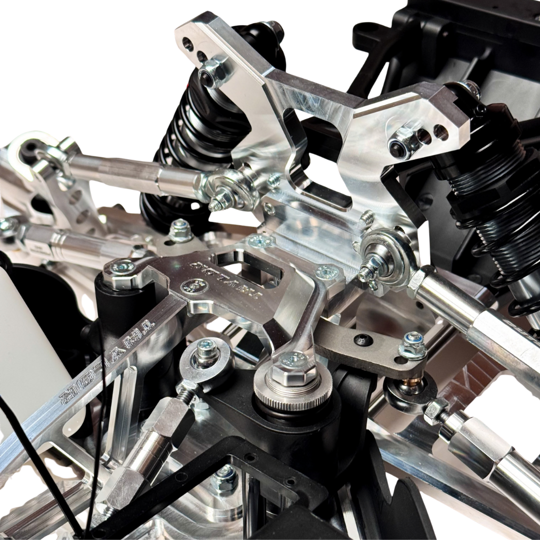 Taylor RC Complete Outlaw V4 Billet Hybrid Slider, close-up of the front shock towers, shocks, and steering linkage