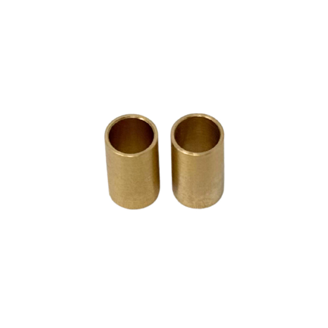 Two brass cylindrical objects on a white background