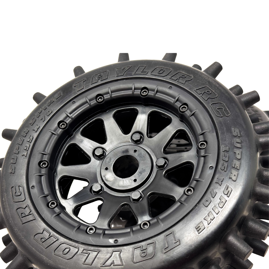 Close-up of a Taylor RC tire and rim on a white background