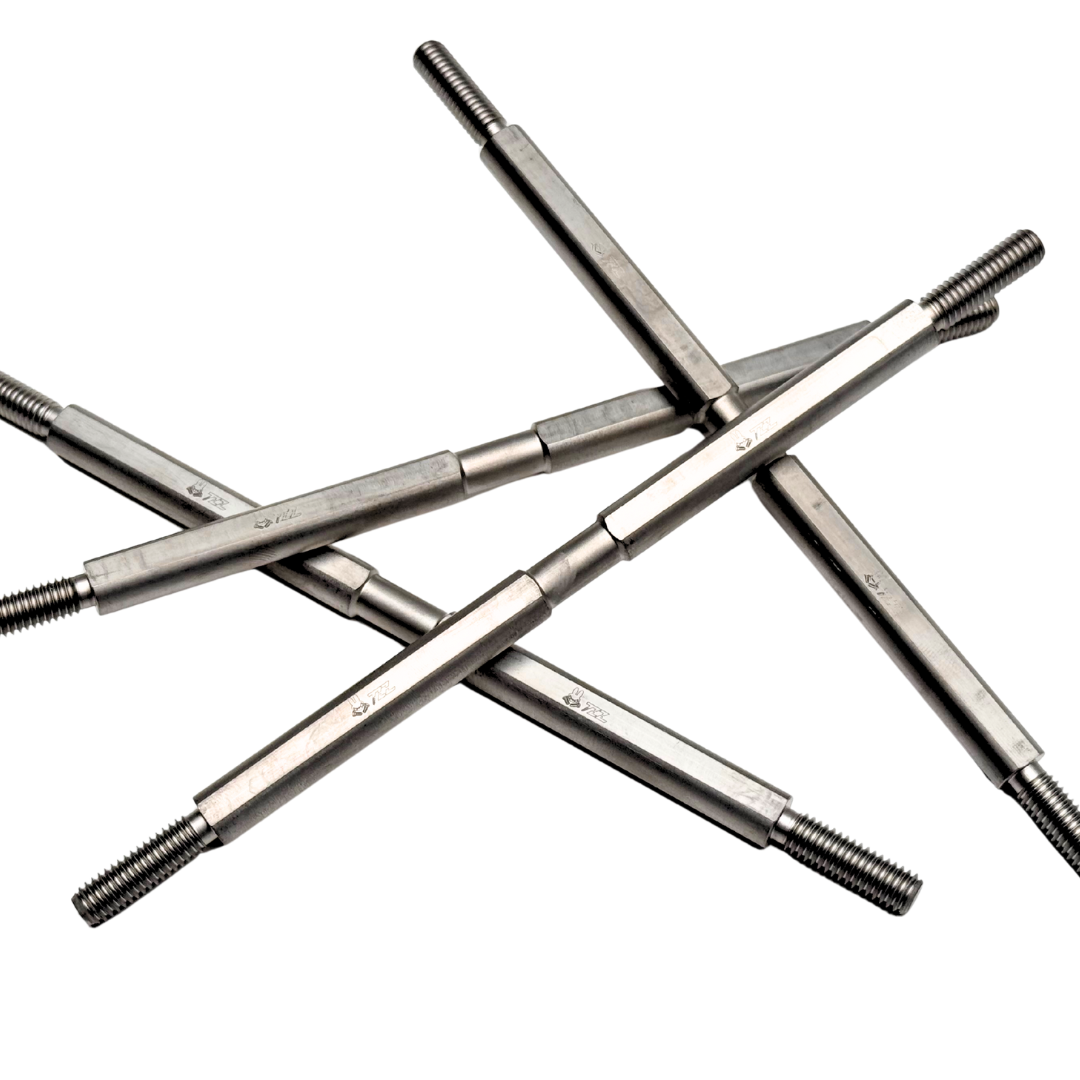 Crossed metal rods with threaded ends on a white background