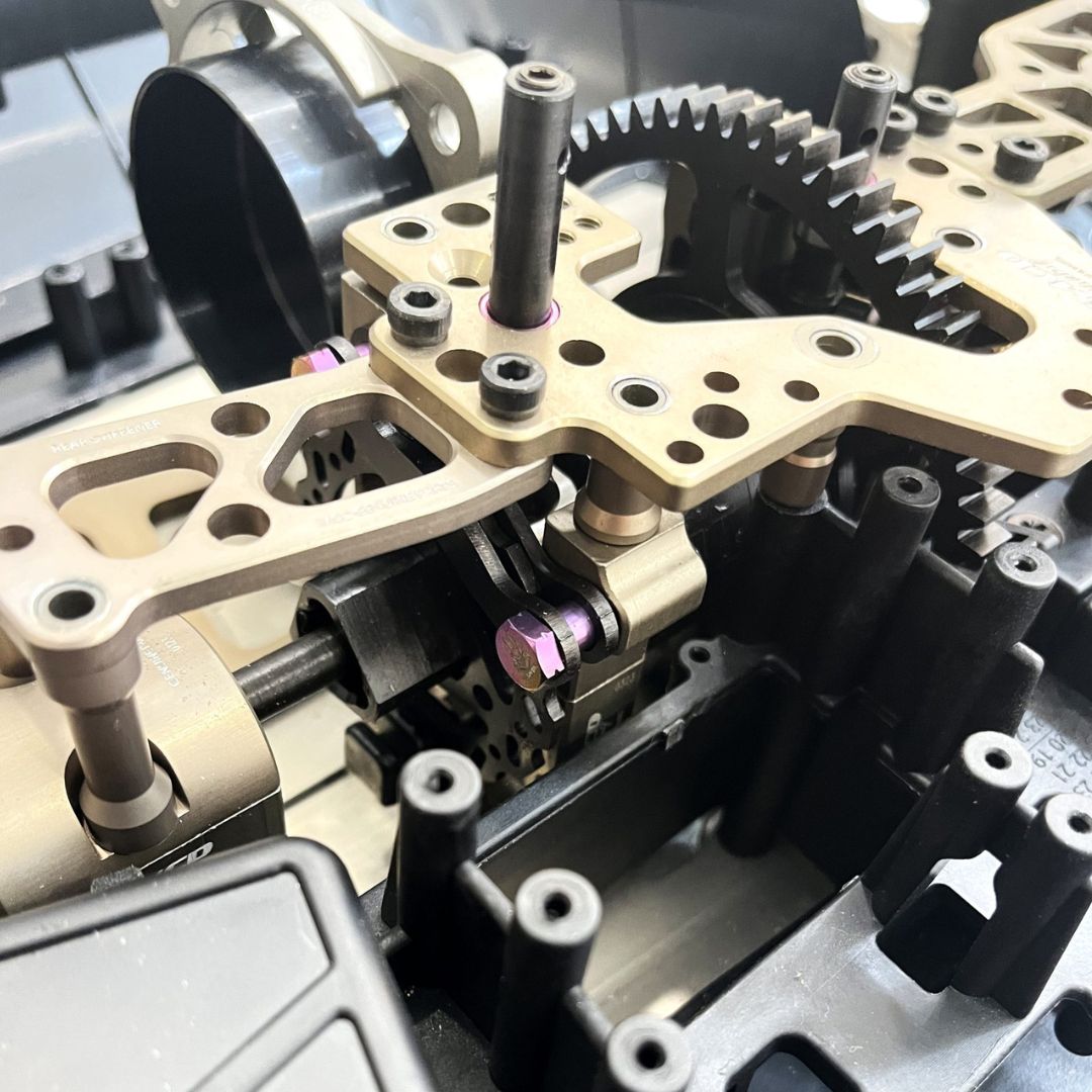 Close-up of mechanical gear system with gold and black components