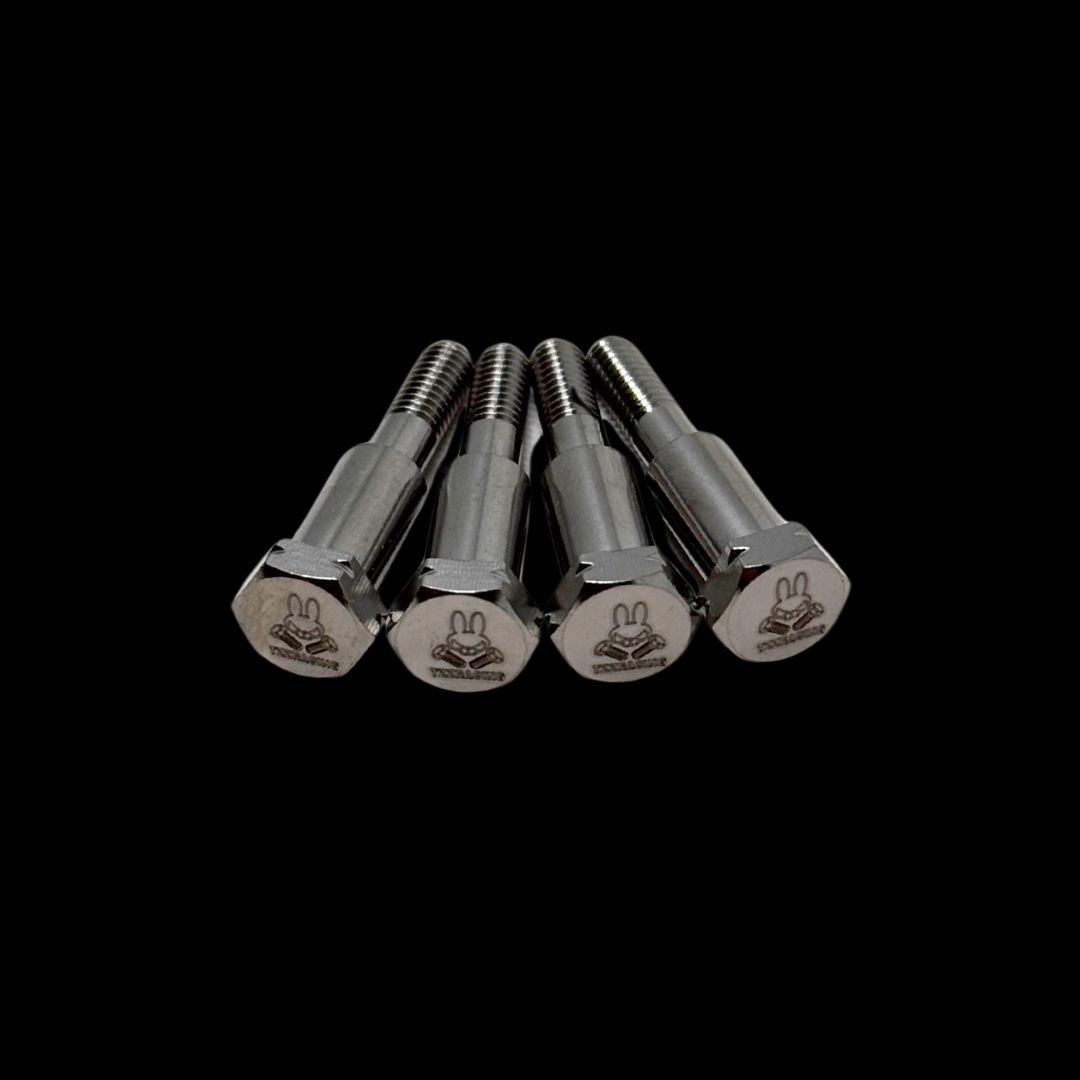 Four metal bolts with tzz logo on a black background