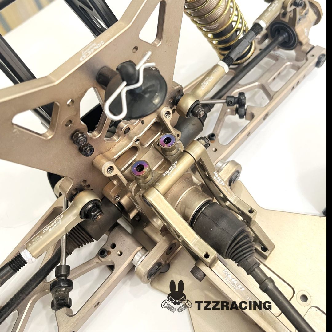 Close-up of a MCD Racing rear suspension and chassis with TZZRACING branding.