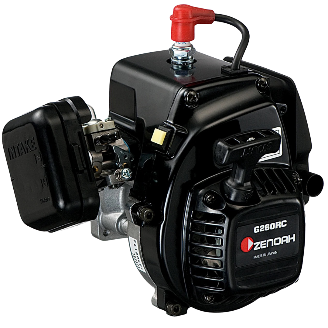 Zenoah G260RC 2-stroke gasoline engine with a black body, silver metal components, a red fuel cap, and a black air filter cover, shown on a white background.