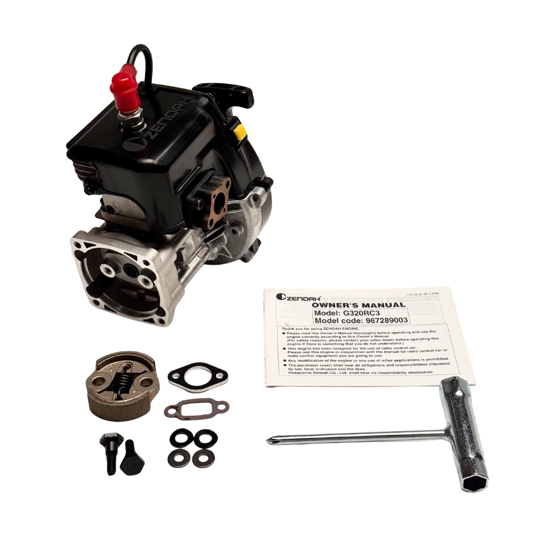 Engine block with components and owner's manual on a white background