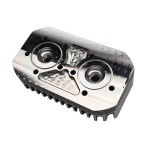 Metallic engine cylinder head on a white background