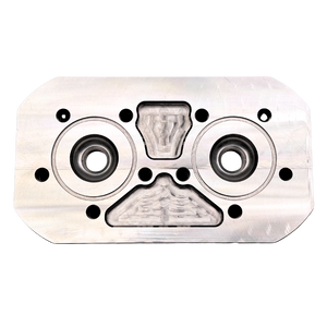 Metallic engine cylinder head on a white background