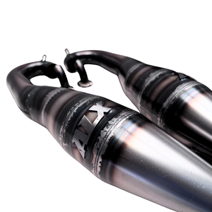 Close-up of an RC car exhaust system with 'ALX' branding on a white background