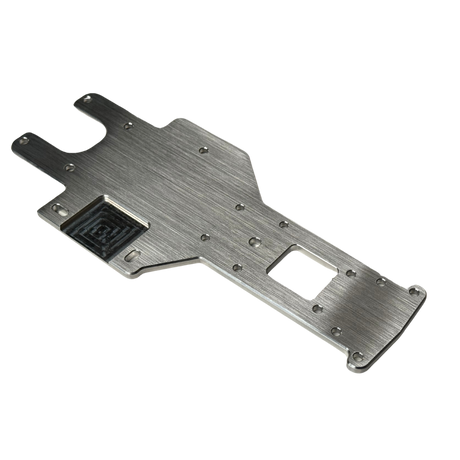 Metallic chassis plate with cutouts on a white background