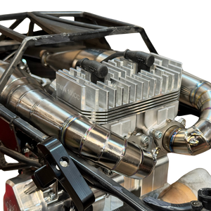 Close-up of an ALX titanium twin exhaust pipe fitted to a Baja engine bay