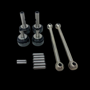 A set of metal dogbone kit parts for a remote control toy, including shafts and pins, displayed on a clear surface.