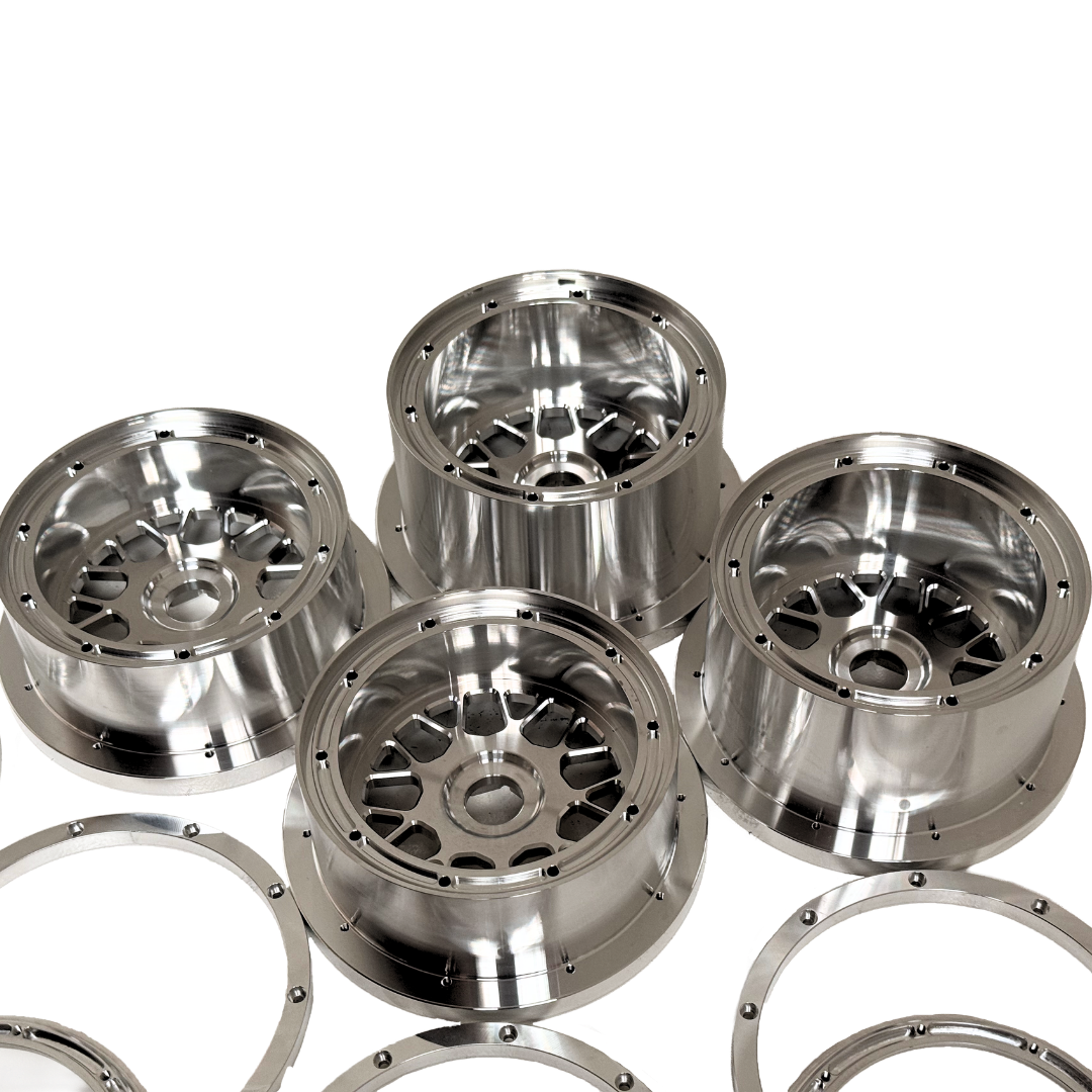 Beast RC Baja 5B complete billet wheel set with 8-piece beadlocks, close-up view of the wide 5B rear wheels and hidden-bolt beadlock rings