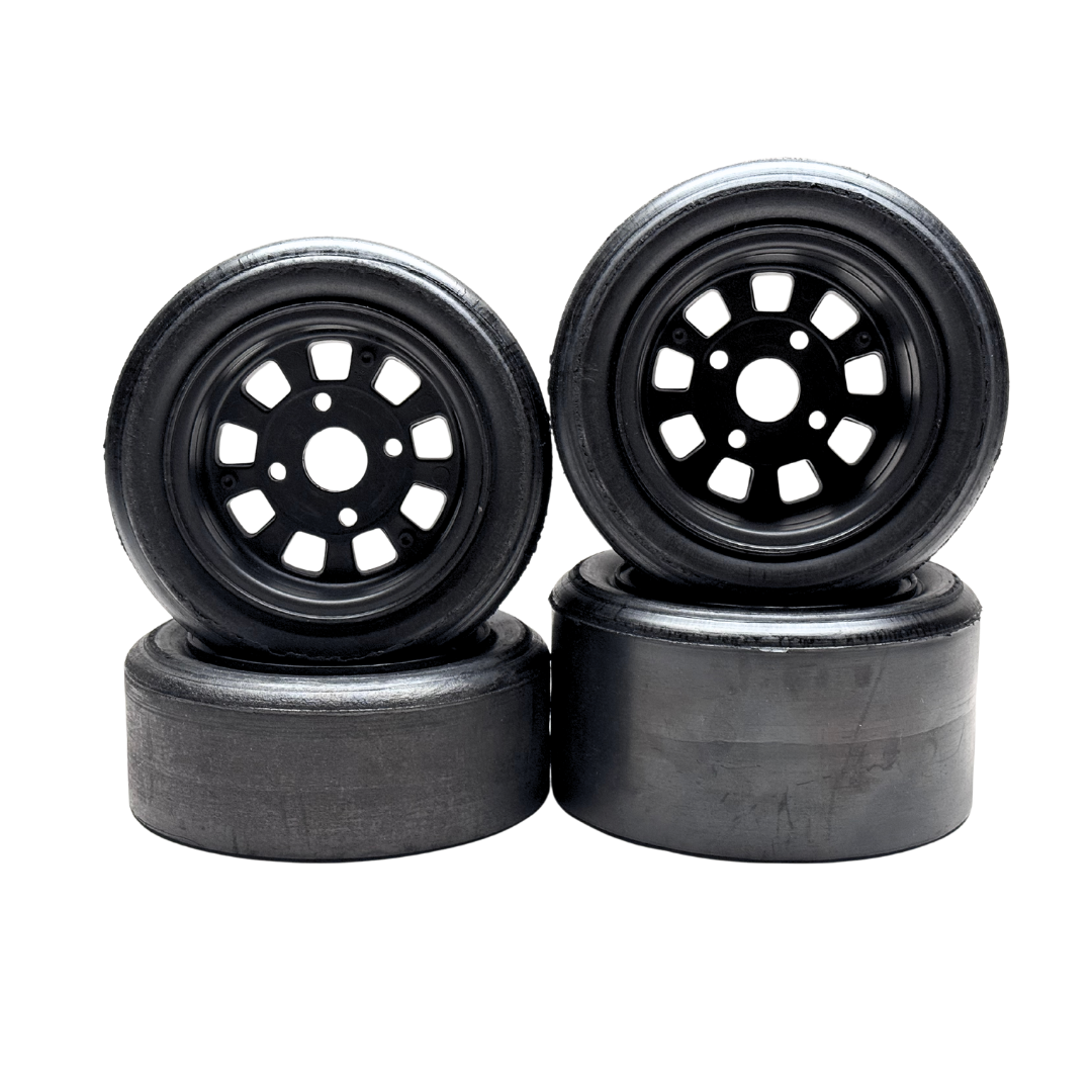 Four black wheels with plastic rim on a white background