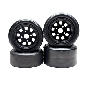Four black wheels with plastic rim on a white background