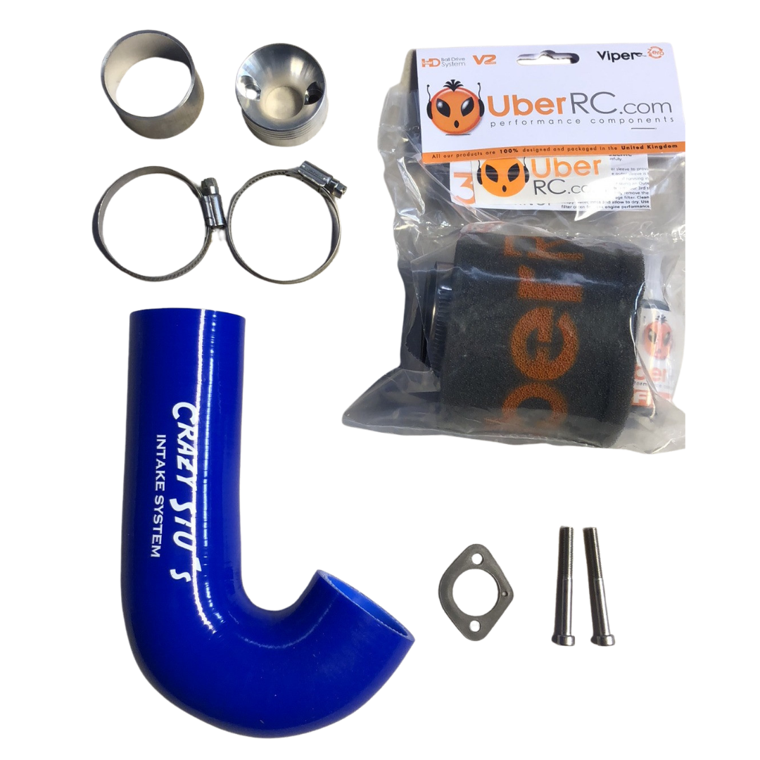 Collection of automotive parts including a blue intake system, metal clamps, and a package labeled 'Uber RC' on a white background.