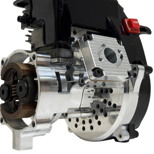 Close-up of the HPRC 34cc race ported Zenoah engine's raw silver billet bell housing, showing the clutch shoe, vented cooling holes and reed case mount